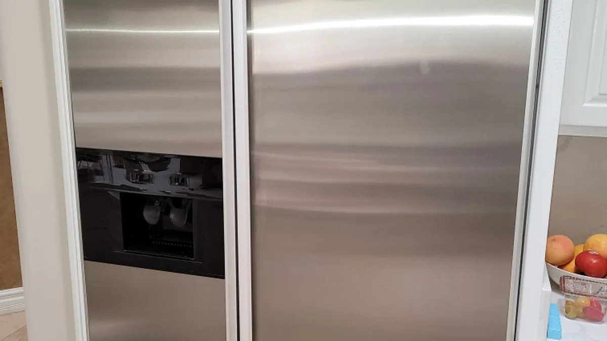 Factory-certified appliance repair technician servicing luxury refrigeration, laundry suites, and cooking ranges in Saratoga, CA
